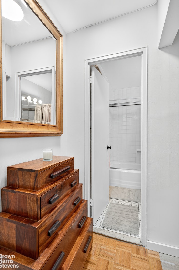 520 East 72nd Street, Unit 3R Manhattan, NY 10021 - Photo 7 of 16 a view of room with wooden floor and cabinet