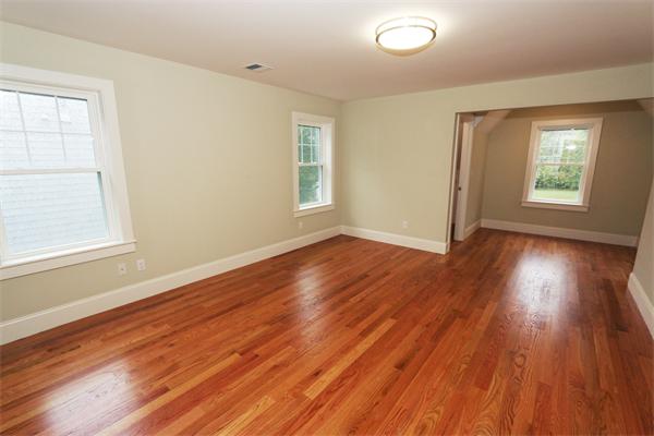 59 Kilburn Road Newton, MA 02465 - Photo 13 of 21 an empty room with wooden floor and windows
