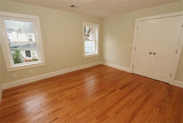 59 Kilburn Road Newton, MA 02465 - Photo 15 of 21 a view of an empty room with wooden floor and a window