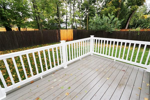 59 Kilburn Road Newton, MA 02465 - Photo 20 of 21 a balcony with wooden floor and trees
