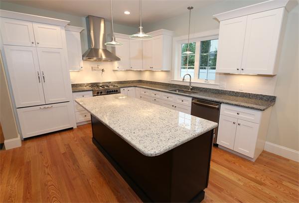 59 Kilburn Road Newton, MA 02465 - Photo 2 of 21 a kitchen with stainless steel appliances granite countertop a sink a stove and a wooden floors