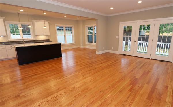 59 Kilburn Road Newton, MA 02465 - Photo 6 of 21 a view of a kitchen with granite countertop a large counter top and stainless steel appliances