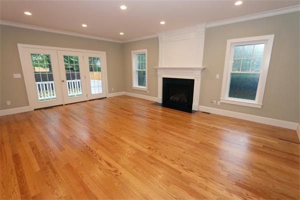 59 Kilburn Road Newton, MA 02465 - Photo 7 of 21 a view of empty room with wooden floor and fireplace