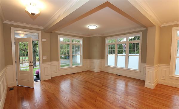59 Kilburn Road Newton, MA 02465 - Photo 9 of 21 a view of an empty room with wooden floor and a window