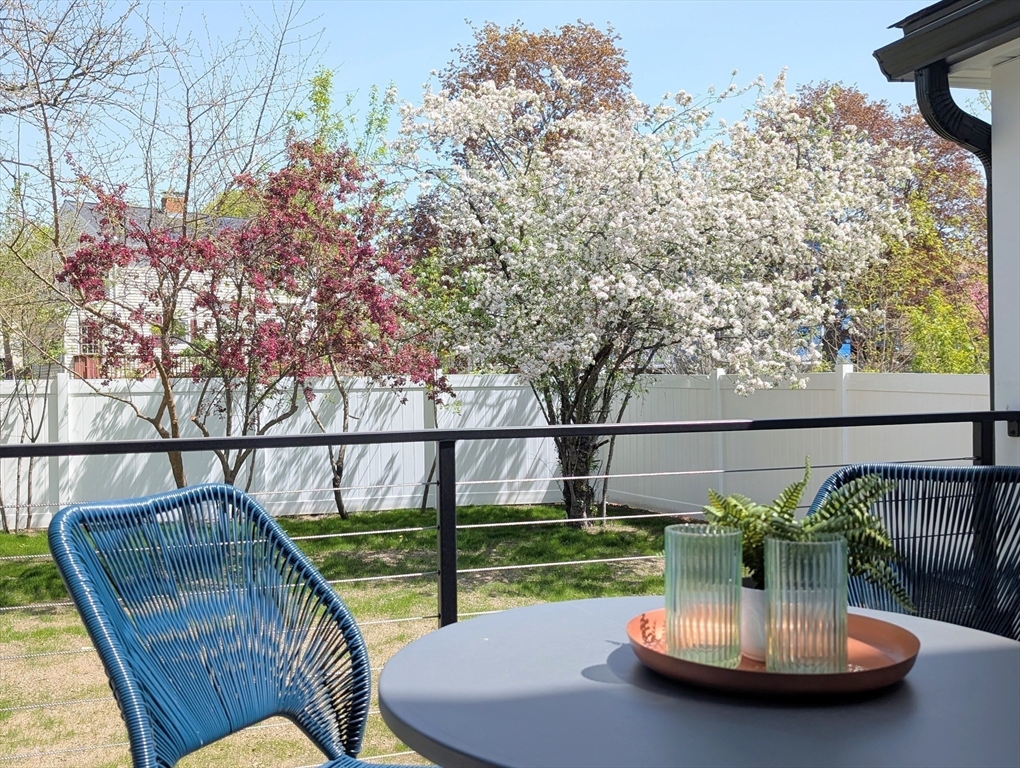 6 Gordon Road, Unit 6 Arlington, MA 02474 - Photo 11 of 40 a view of a balcony with two chairs