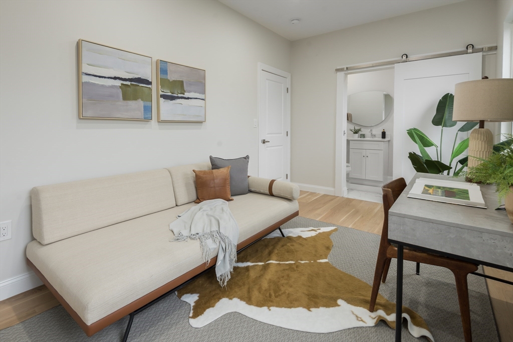 6 Gordon Road, Unit 6 Arlington, MA 02474 - Photo 14 of 40 a living room with furniture and wooden floor
