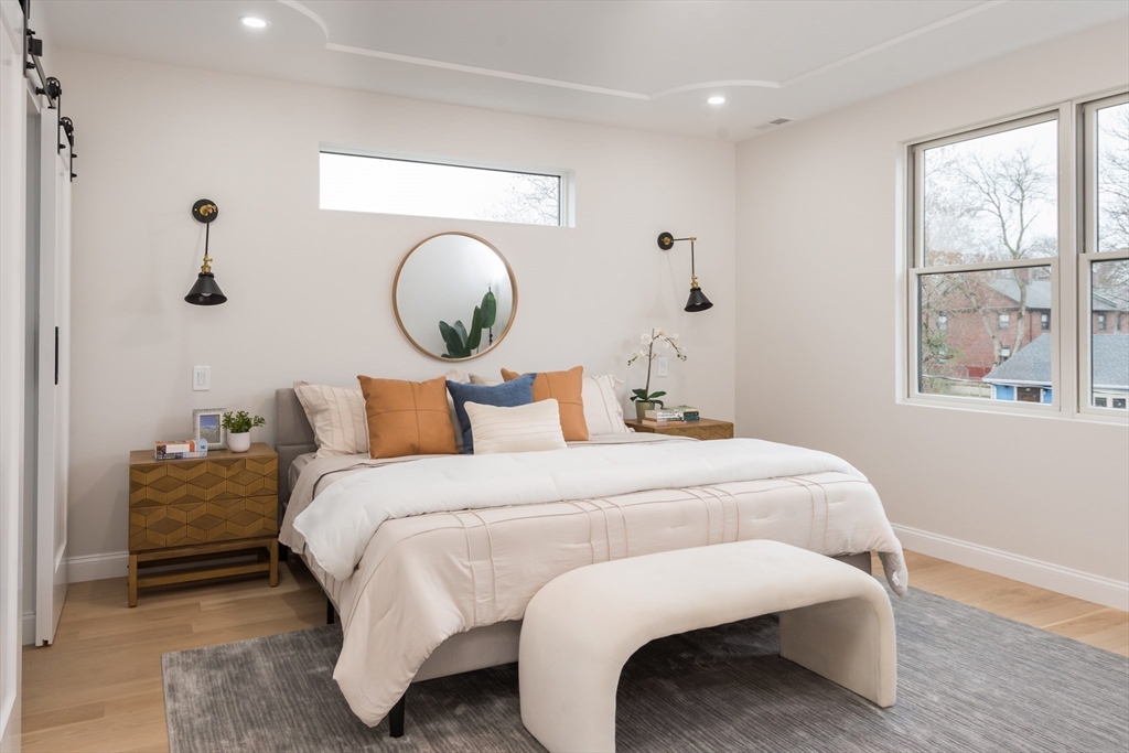 6 Gordon Road, Unit 6 Arlington, MA 02474 - Photo 18 of 40 a bedroom with bed and window