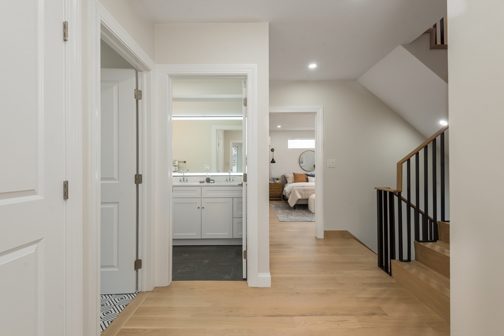 6 Gordon Road, Unit 6 Arlington, MA 02474 - Photo 25 of 40 a view of a hallway with a livingroom and a bathroom
