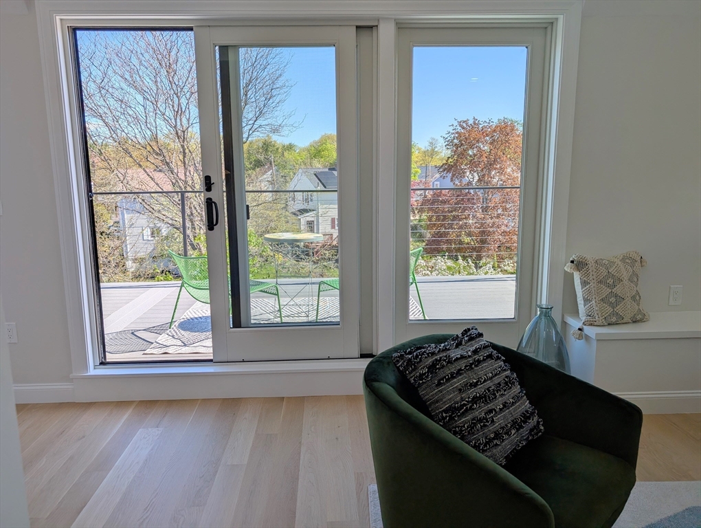 6 Gordon Road, Unit 6 Arlington, MA 02474 - Photo 29 of 40 a bed sitting in a bedroom next to a window