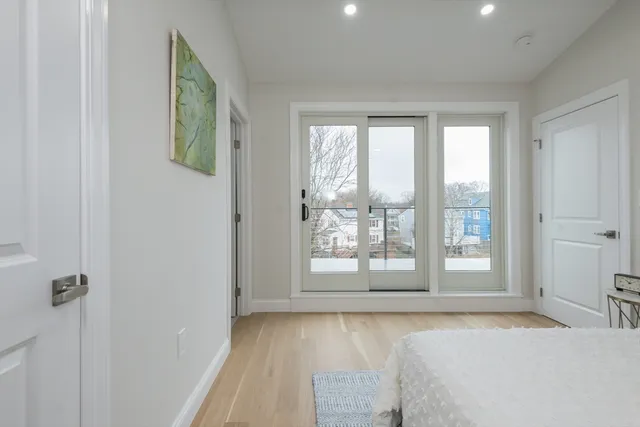 a spacious bedroom with a large bed and a window with outer view