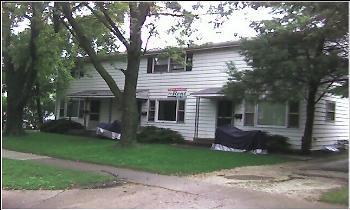 817 Greenbrier Road DeKalb, IL 60115 - Photo 1 of 1 front view of a house with a garden
