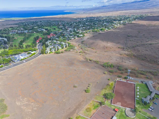 a view of a pathway with a field