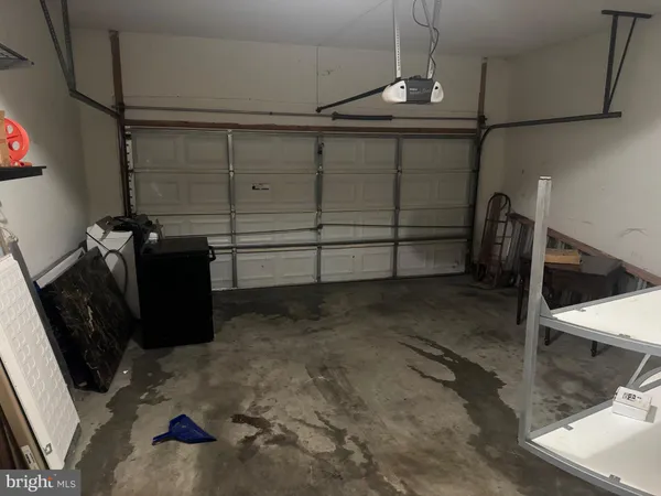 a view of an empty room with a fireplace