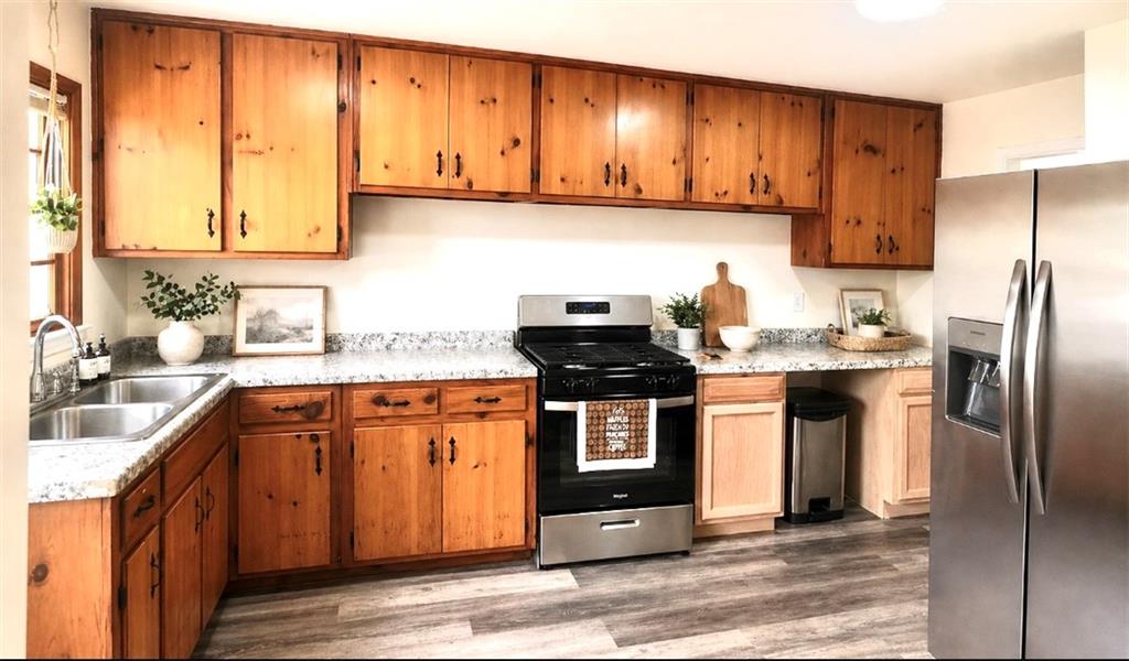 119 Fifth Avenue Jonesboro, GA 30236 - Photo 13 of 29 a kitchen with stainless steel appliances granite countertop a sink stove and refrigerator