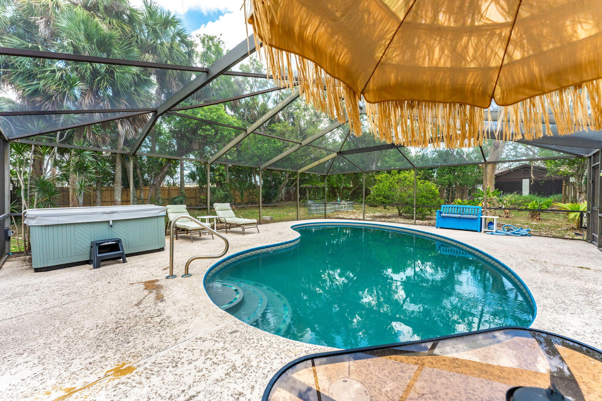 7680 Highway 1 Micco, FL 32976 - Photo 18 of 84 a view of a swimming pool with a patio and a backyard