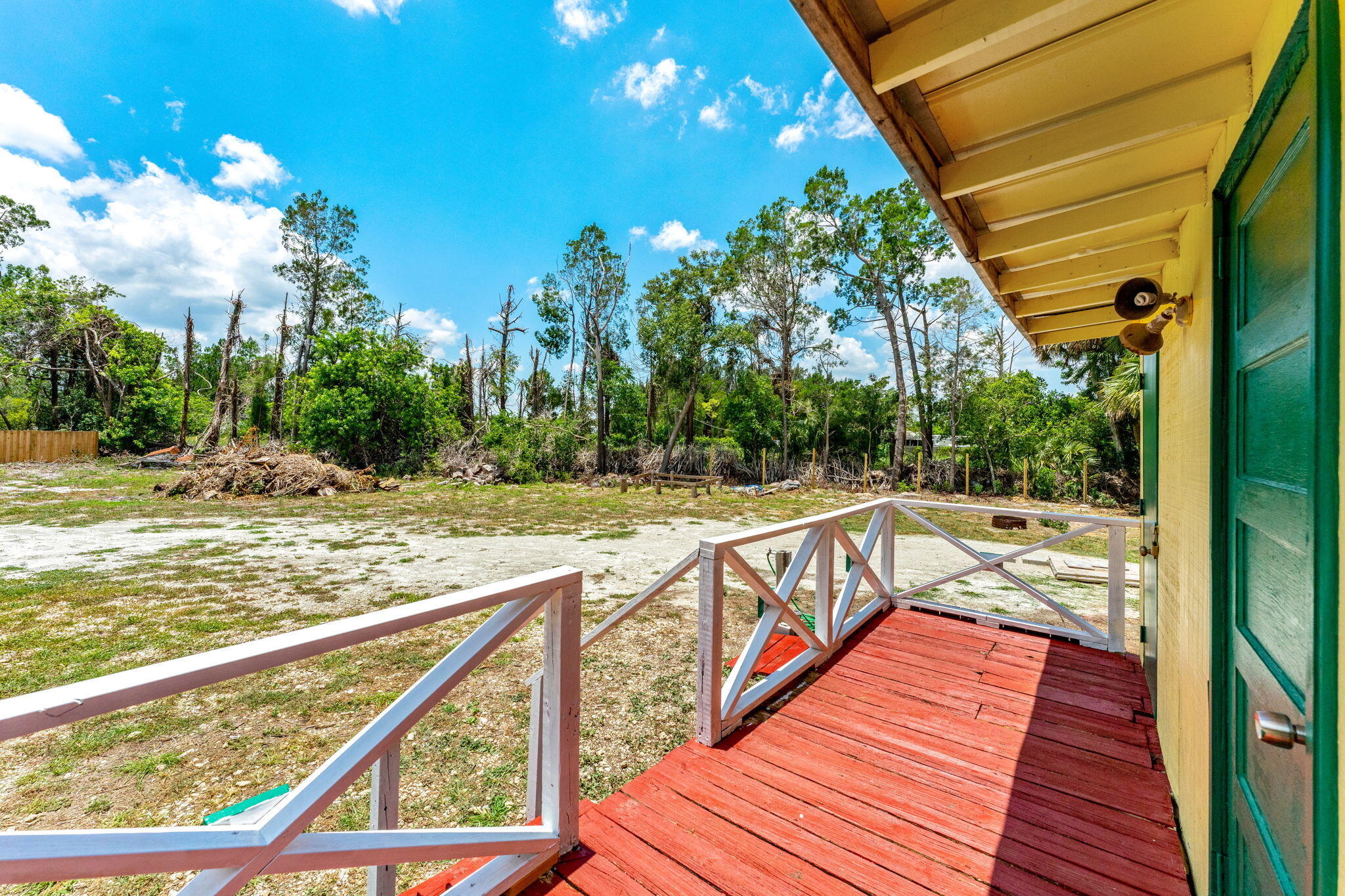 7680 Highway 1 Micco, FL 32976 - Photo 27 of 84 a view of balcony with wooden floor and fence