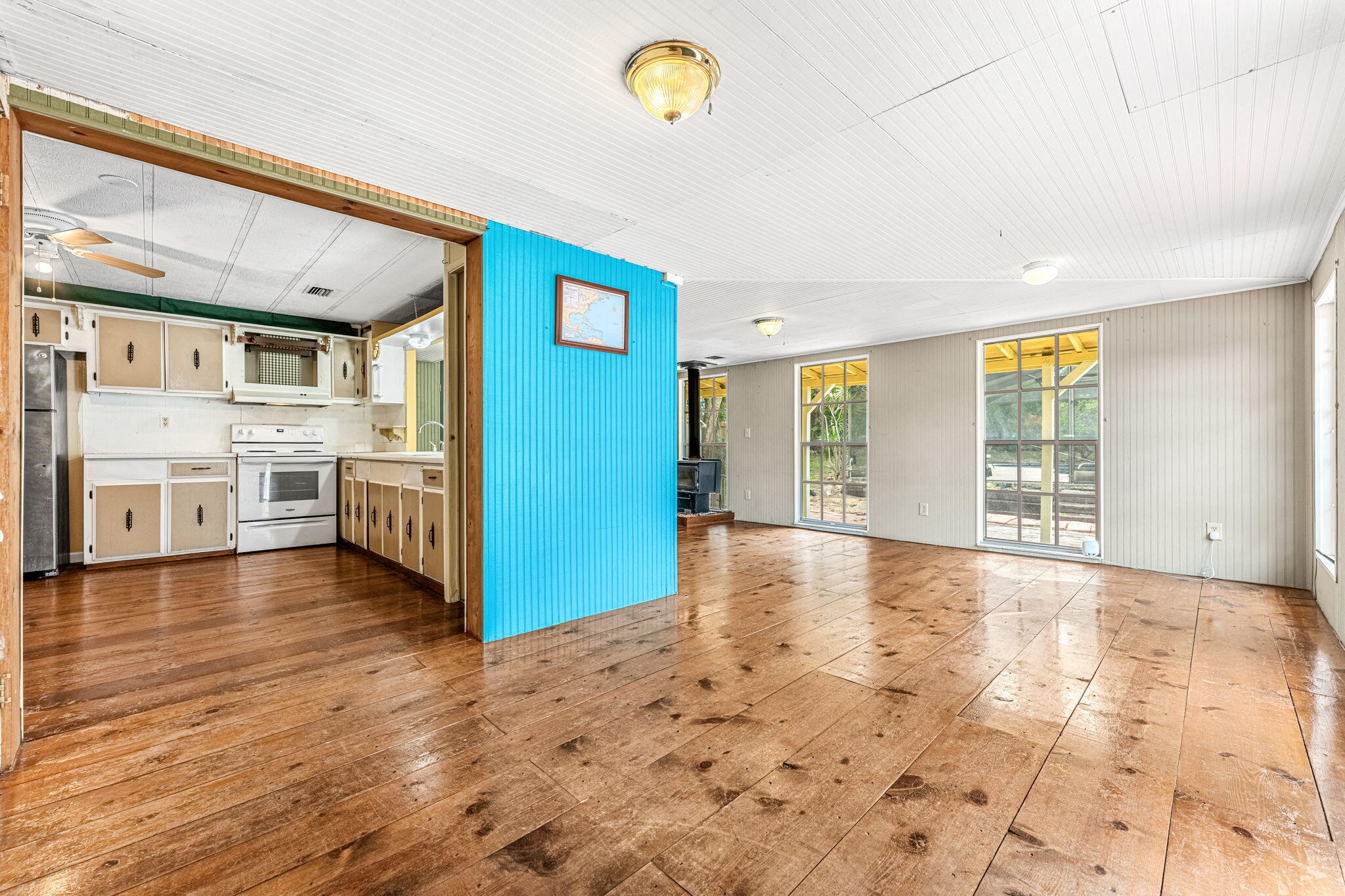 7680 Highway 1 Micco, FL 32976 - Photo 32 of 84 a view of a kitchen with a stove cabinets and wooden floor