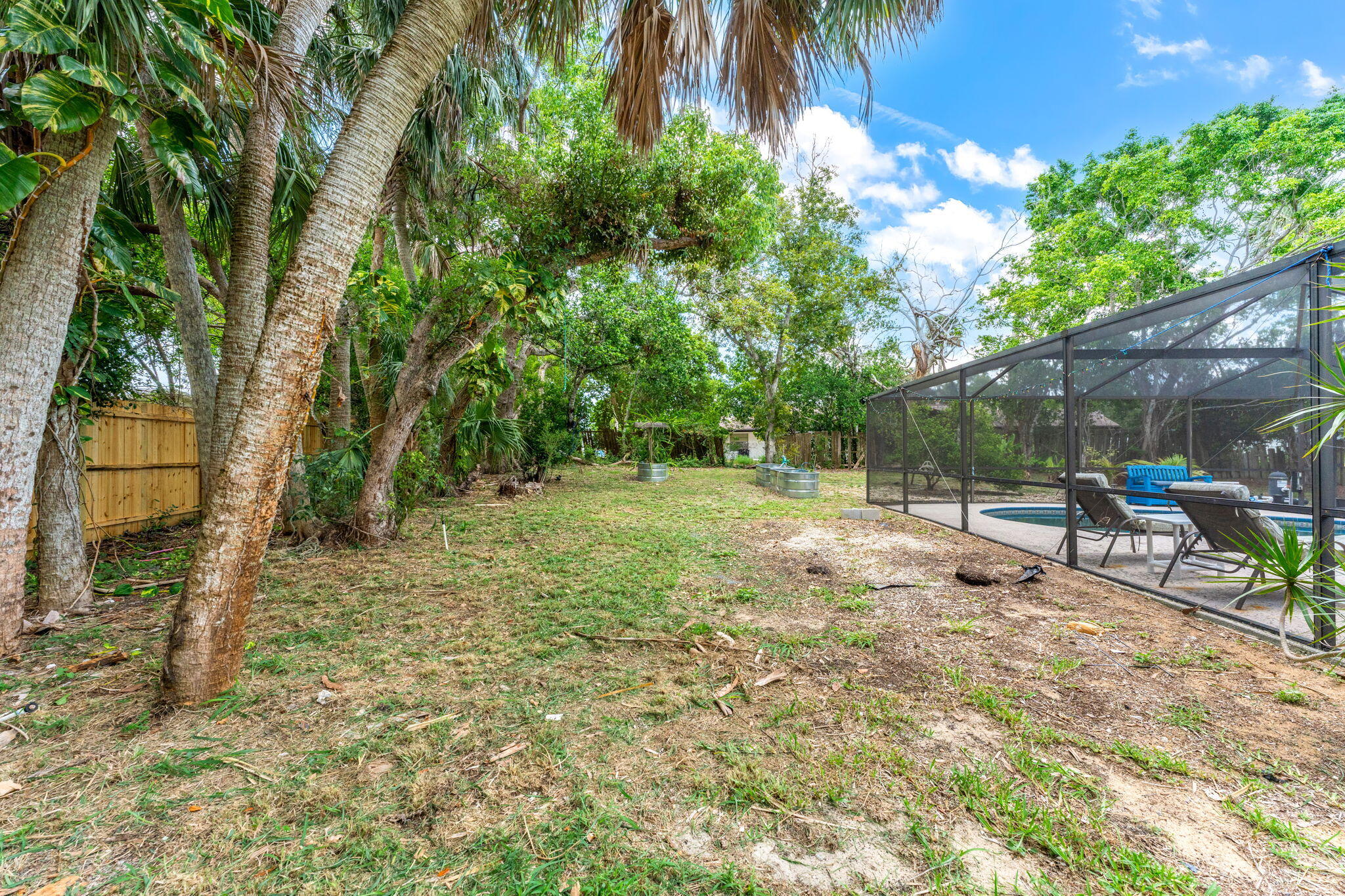7680 Highway 1 Micco, FL 32976 - Photo 40 of 84 a view of backyard with green space and seating area