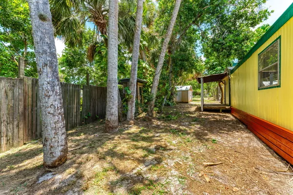 a view of a house with swimming pool and porch with furniture