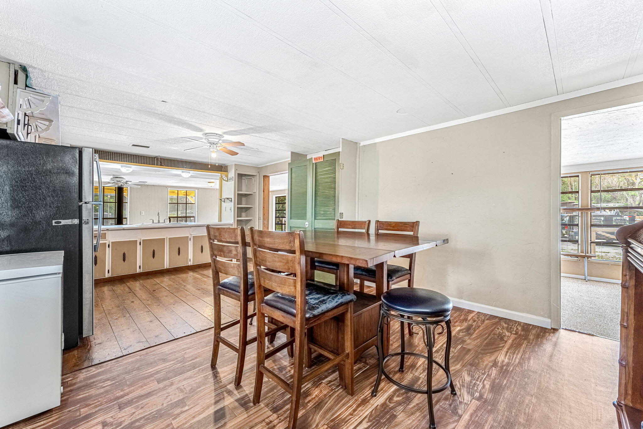 7680 Highway 1 Micco, FL 32976 - Photo 62 of 84 a view of a dining room with furniture and wooden floor