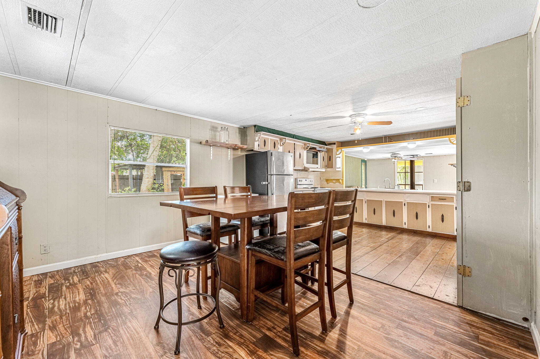 7680 Highway 1 Micco, FL 32976 - Photo 63 of 84 a view of a dining room with furniture and wooden floor