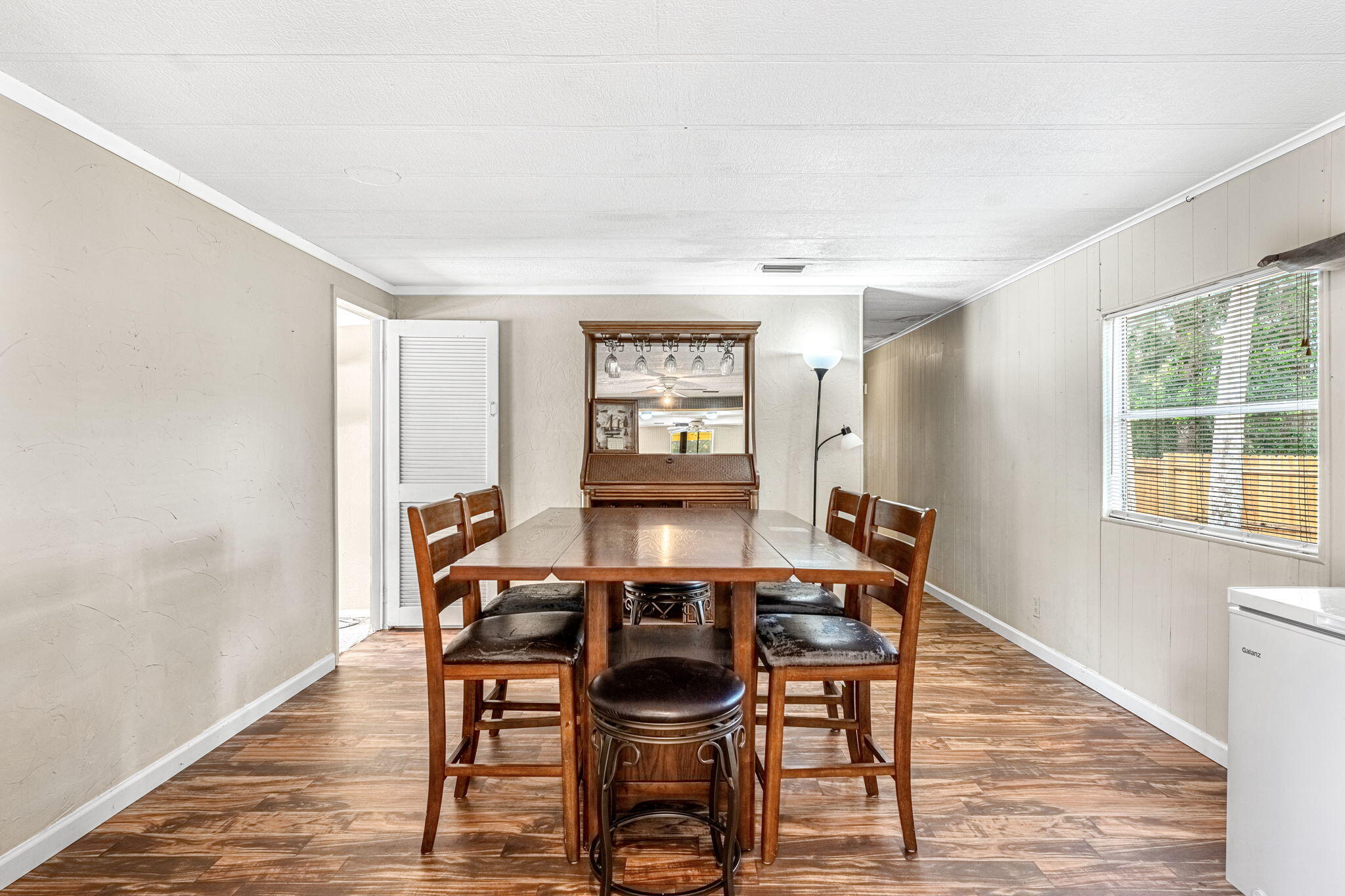 7680 Highway 1 Micco, FL 32976 - Photo 64 of 84 a view of a dining room with furniture and wooden floor