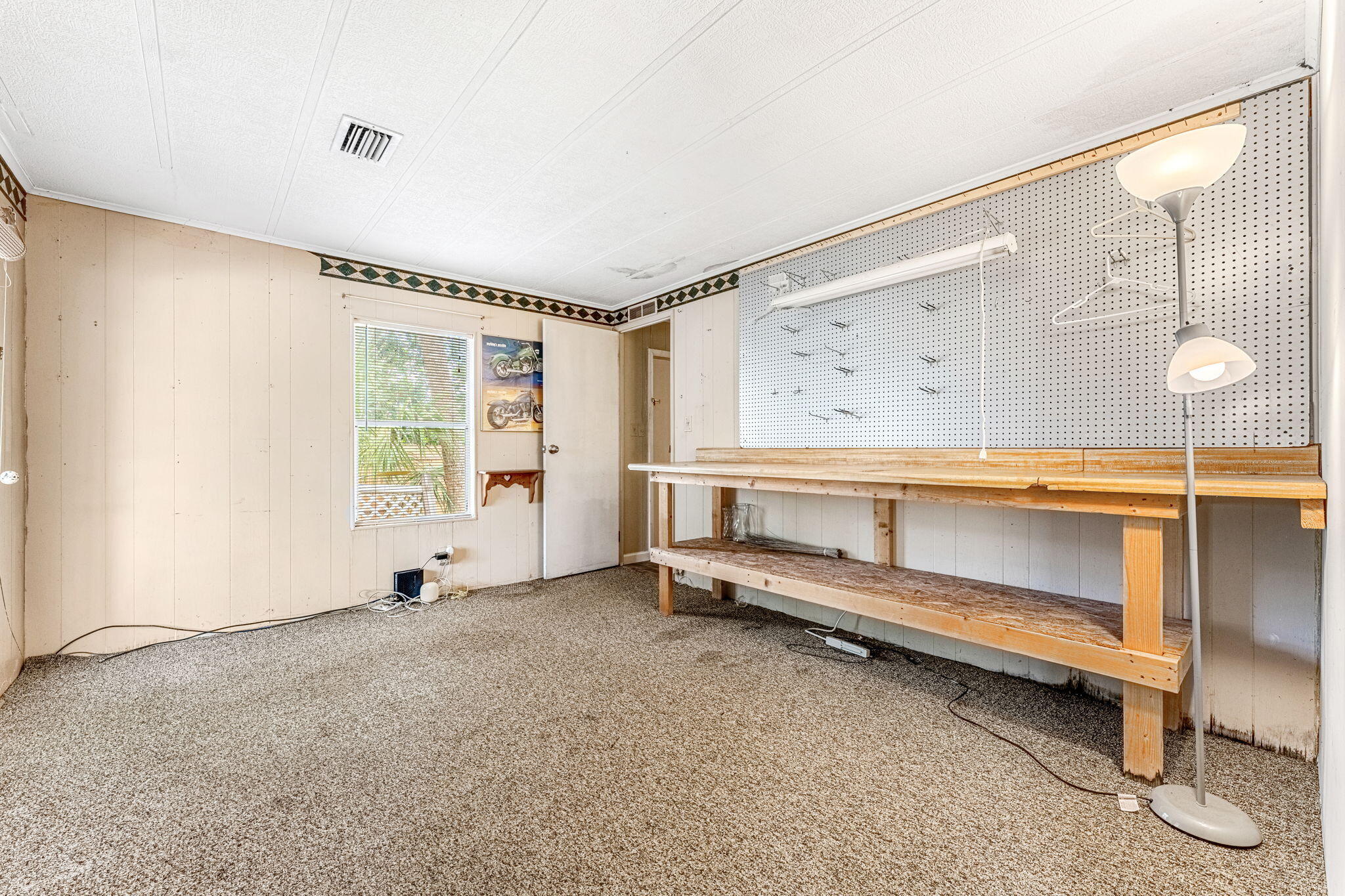 7680 Highway 1 Micco, FL 32976 - Photo 71 of 84 a view of an empty room with a window