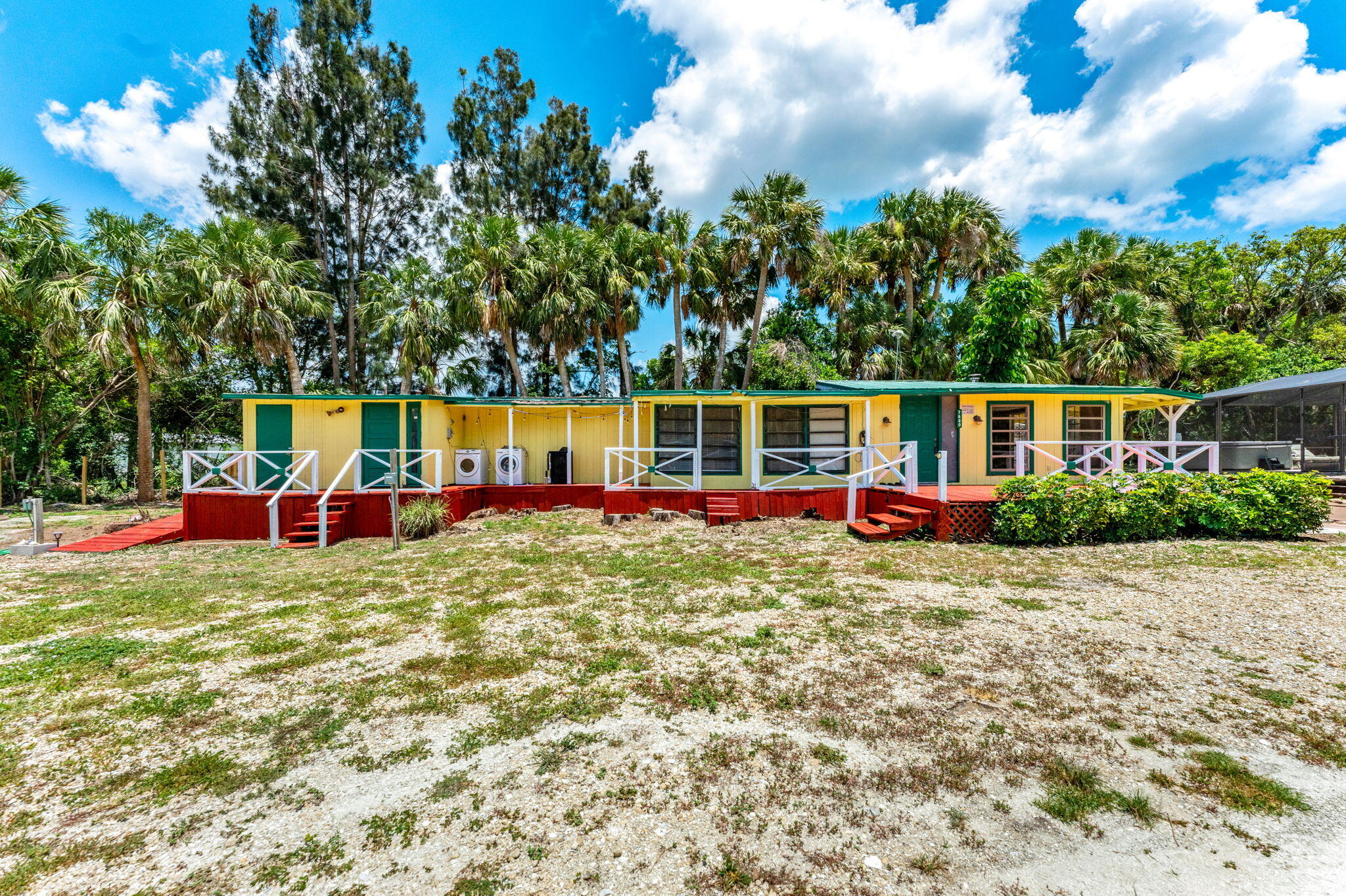 7680 Highway 1 Micco, FL 32976 - Photo 10 of 84 a view of swimming pool with table and chairs a barbeque in the yard