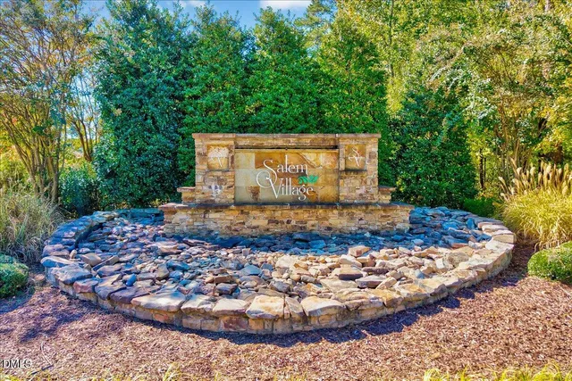a aerial view of a house with swimming pool garden and patio