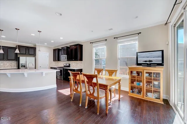 a view of kitchen with cabinets and wooden floor