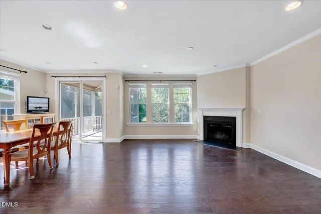 a view of a livingroom with furniture window and wooden floor