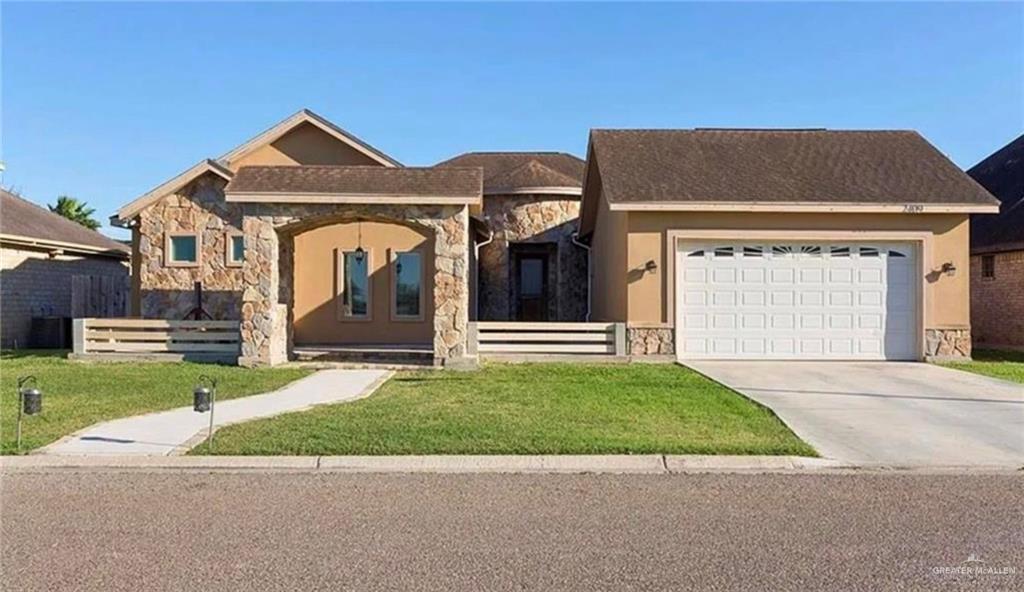 2409 Rhett Drive Pharr, TX 78577 - Photo 1 of 1 a front view of a house with a garden and yard