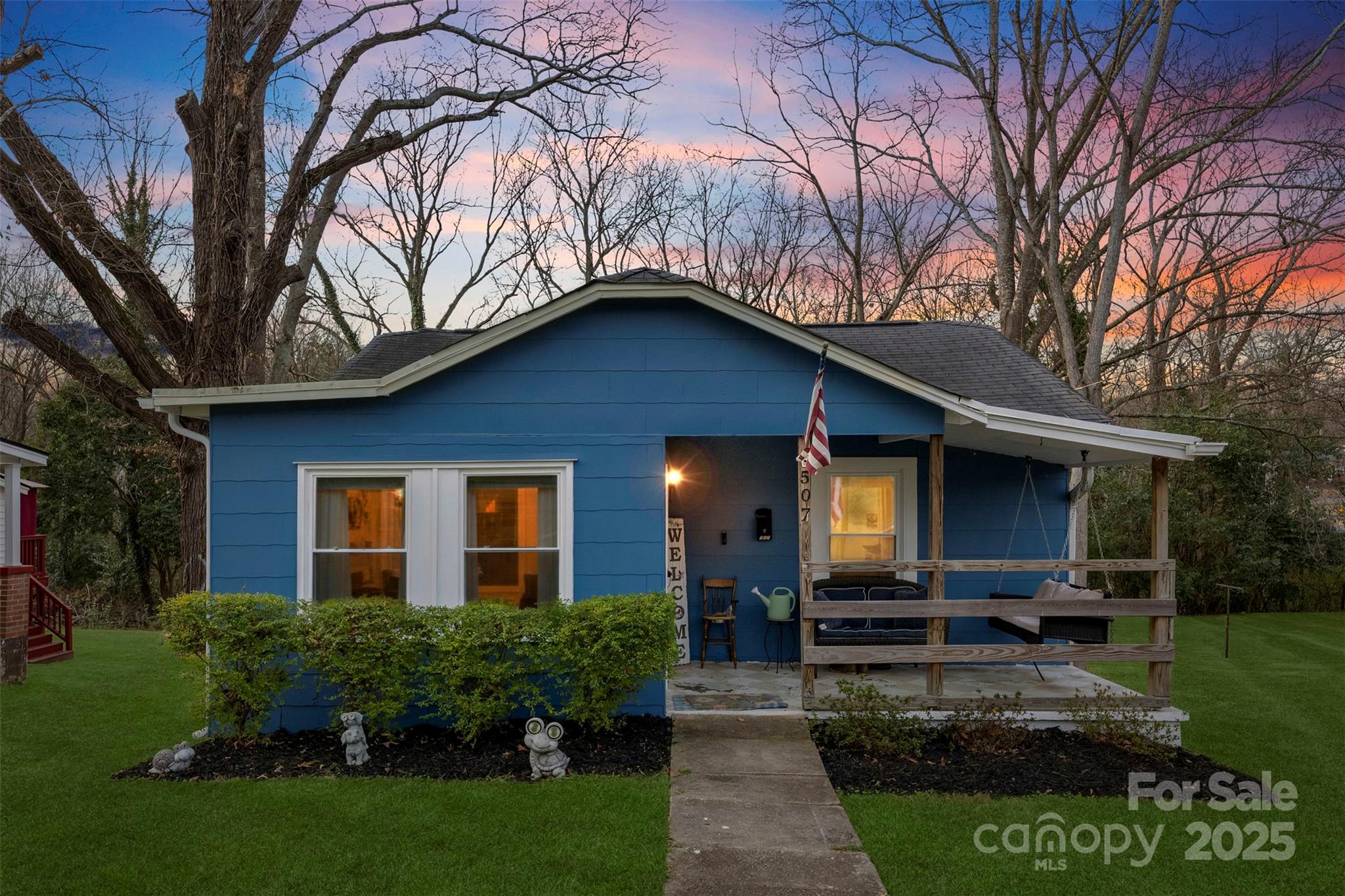 a front view of a house with garden