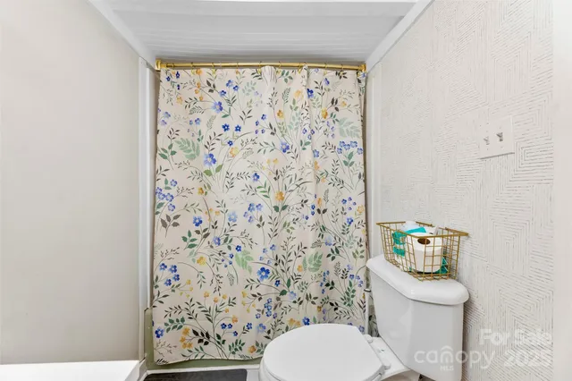 a bathroom with a toilet and a sink