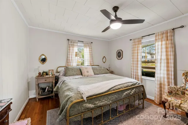 a bedroom that has a bed and a table in it