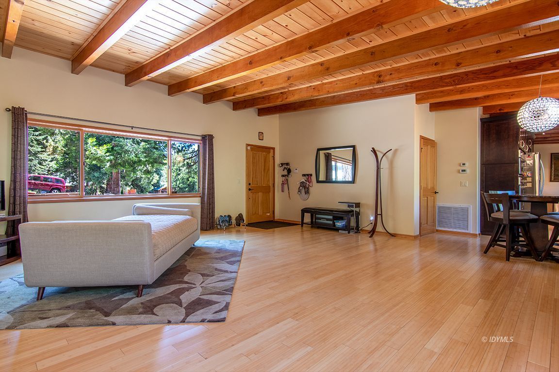 55596 Encino Road Idyllwild, CA 92549 - Photo 11 of 74 a living room with furniture and large windows