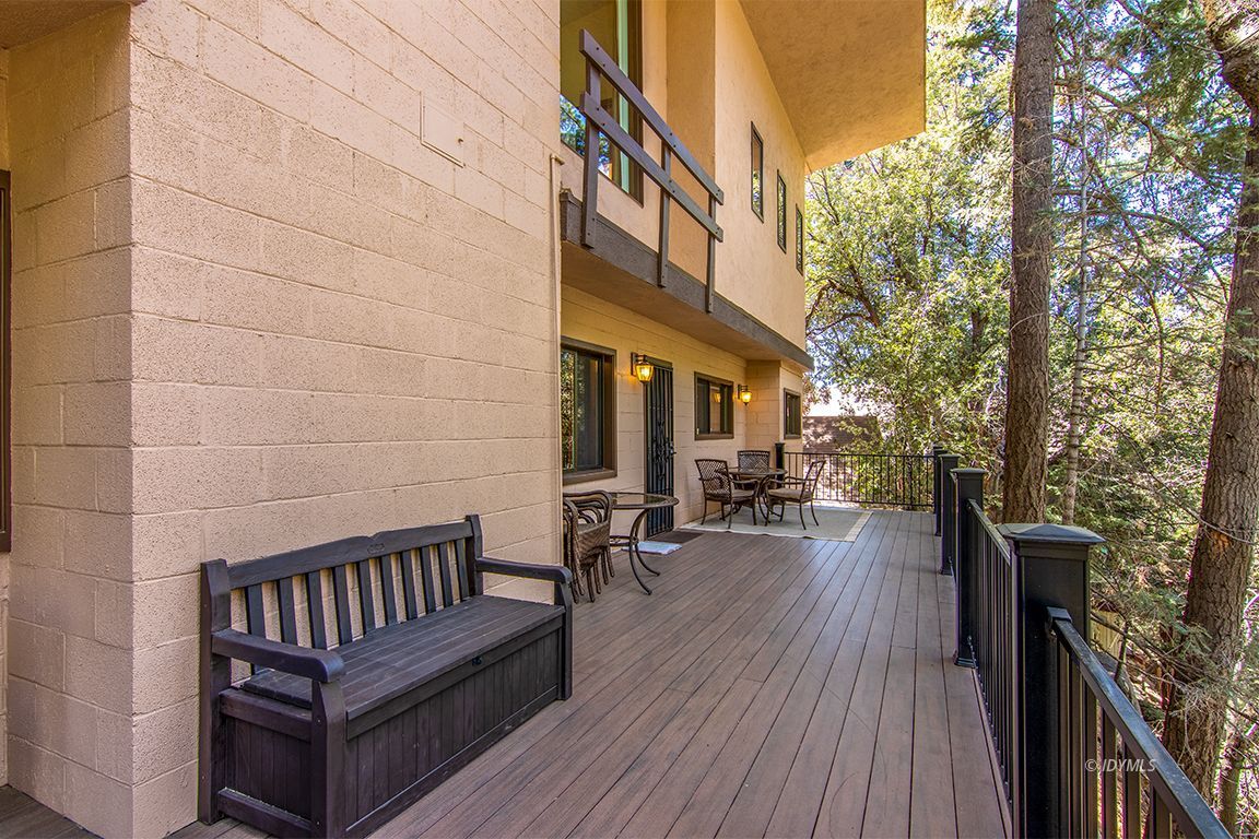 55596 Encino Road Idyllwild, CA 92549 - Photo 23 of 74 a view of a wooden chairs on the deck