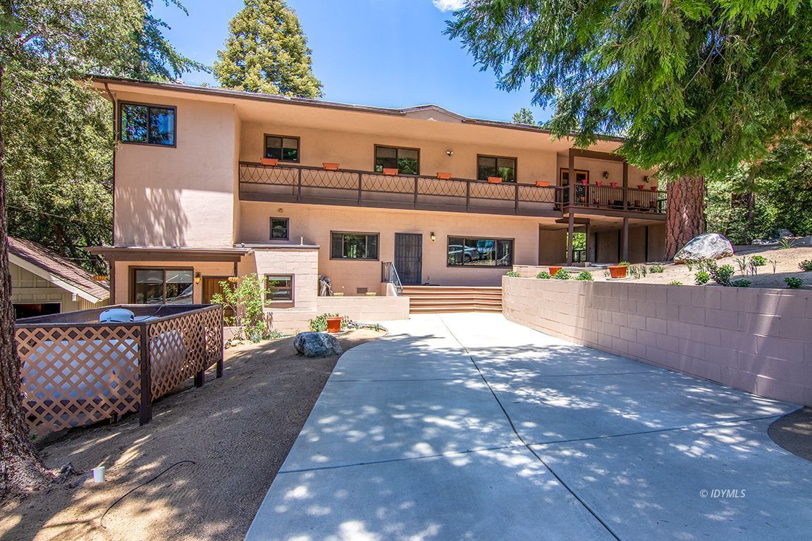 55596 Encino Road Idyllwild, CA 92549 - Photo 4 of 74 a front view of a building with street view