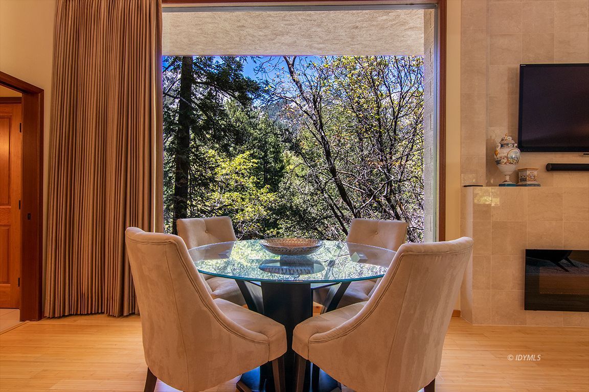 55596 Encino Road Idyllwild, CA 92549 - Photo 31 of 74 a view of a dining room with furniture window and outside view