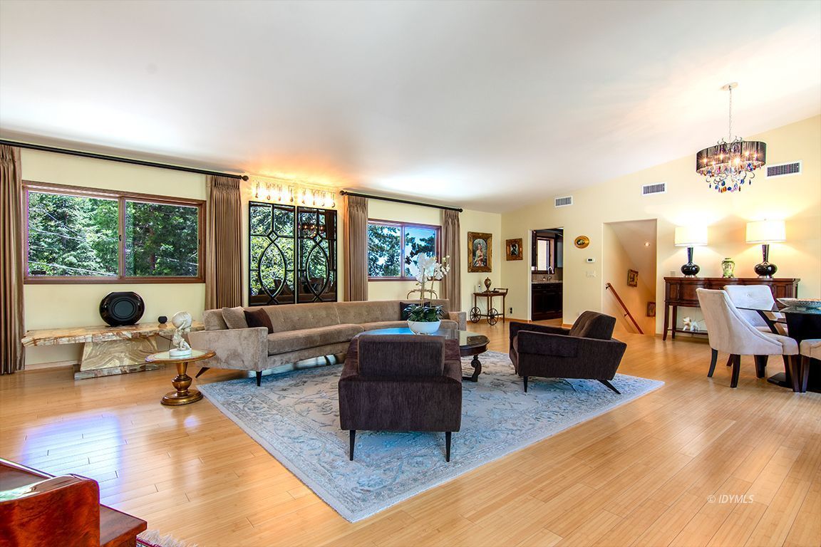 55596 Encino Road Idyllwild, CA 92549 - Photo 35 of 74 a living room with furniture and large windows