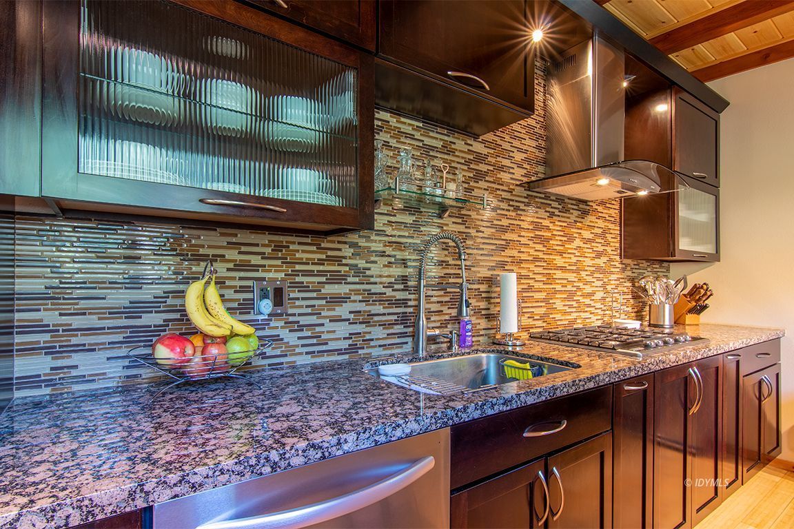 55596 Encino Road Idyllwild, CA 92549 - Photo 63 of 74 a kitchen with stainless steel appliances granite countertop a sink and a wooden cabinets