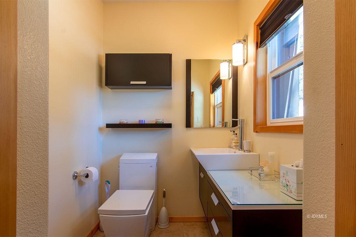 55596 Encino Road Idyllwild, CA 92549 - Photo 67 of 74 a bathroom with a sink a toilet and a mirror
