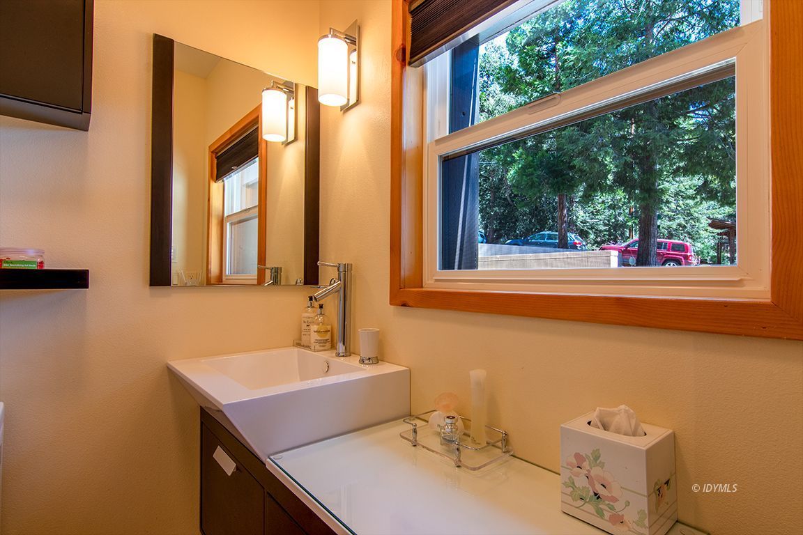 55596 Encino Road Idyllwild, CA 92549 - Photo 68 of 74 a bathroom with a sink and a mirror