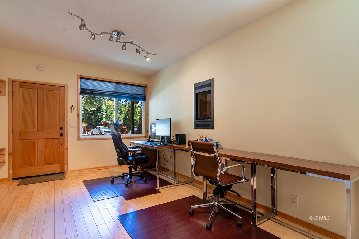 55596 Encino Road Idyllwild, CA 92549 - Photo 69 of 74 a view of a workspace with furniture and a window