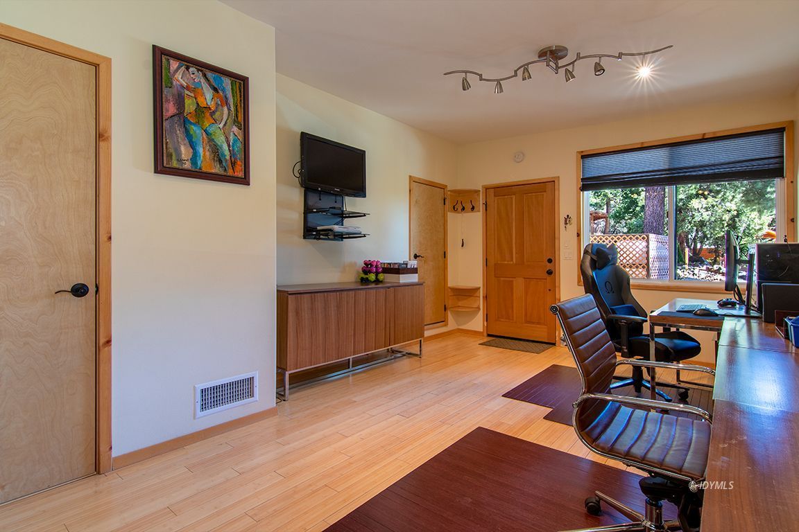 55596 Encino Road Idyllwild, CA 92549 - Photo 70 of 74 a living room with furniture and a flat screen tv