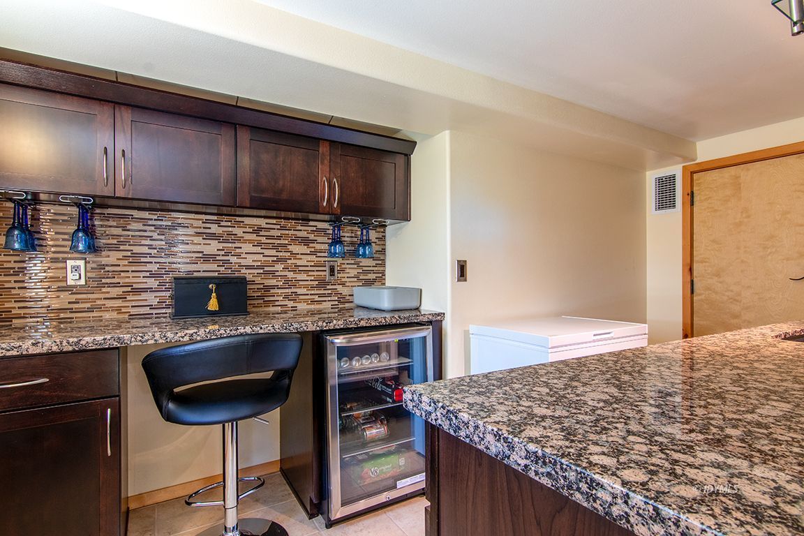 55596 Encino Road Idyllwild, CA 92549 - Photo 73 of 74 a kitchen with stainless steel appliances kitchen island granite countertop a stove a sink and a microwave