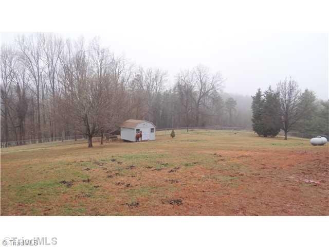 5746 Rolling Meadows Road Randleman, NC 27317 - Photo 14 of 15 Yard/Garden. Fenced in back yard with wired outbuilding. Restrictions allow horses