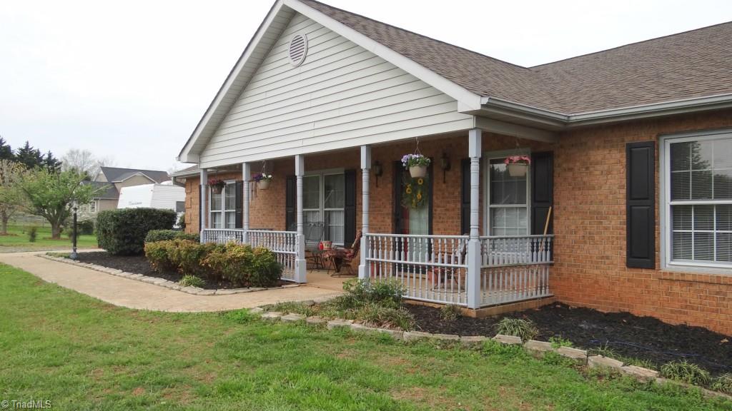 5746 Rolling Meadows Road Randleman, NC 27317 - Photo 15 of 15 Rocking chair front porch