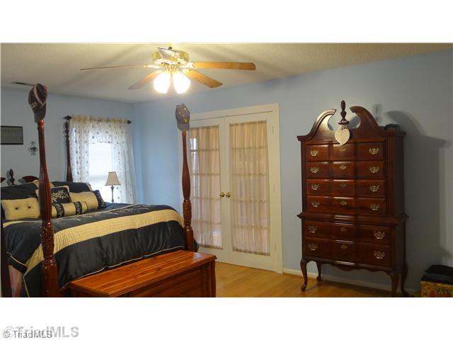 5746 Rolling Meadows Road Randleman, NC 27317 - Photo 5 of 15 Master suite with French doors leading into the Den/Family Room