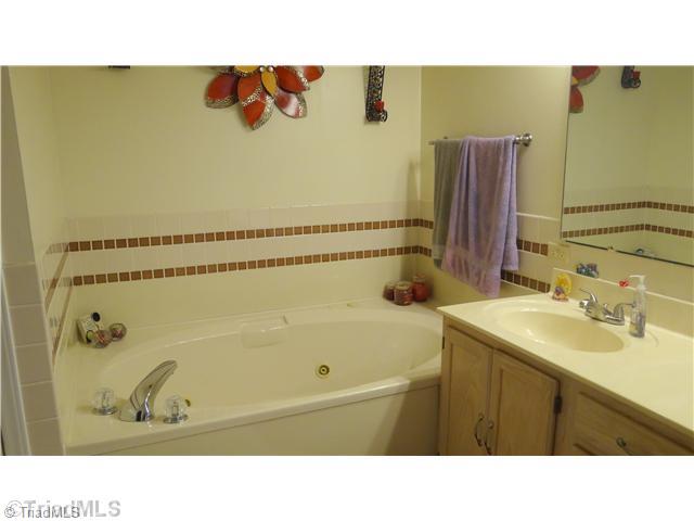 5746 Rolling Meadows Road Randleman, NC 27317 - Photo 6 of 15 Master bath with jetted tub, separate shower and double vanity
